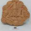Trinacria in terracotta con testa femminile con tre gambe souvenir per turisti simbolo della Sicilia